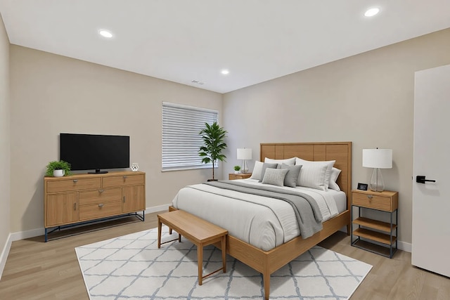 bedroom featuring light wood-type flooring and recessed lighting