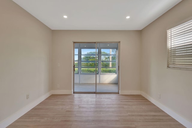 unfurnished room featuring light wood-type flooring