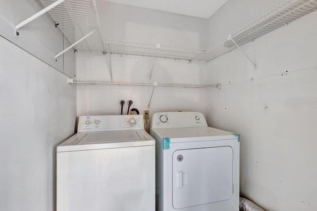 laundry area featuring laundry area and washer and clothes dryer