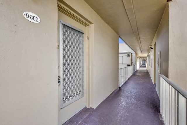 hallway featuring concrete flooring