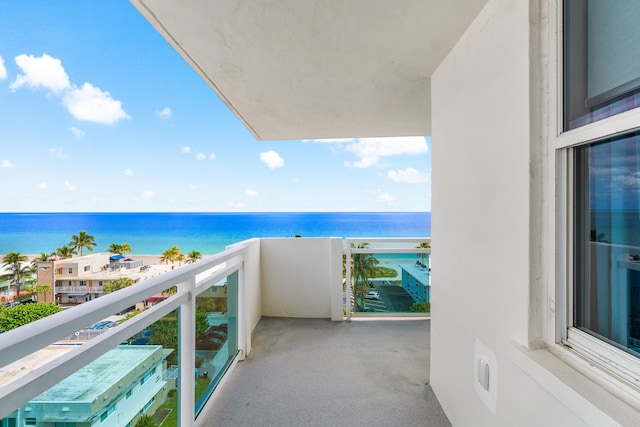 balcony featuring a water view