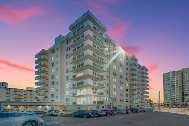 view of outdoor building at dusk