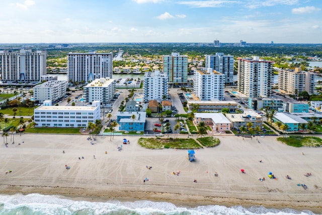 aerial view featuring a water view and a view of the beach