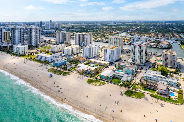 aerial view featuring a water view and a beach view