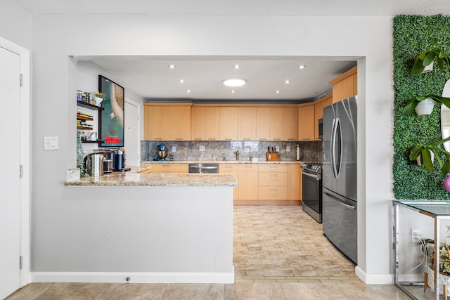 kitchen with light brown cabinets, kitchen peninsula, stainless steel appliances, sink, and light stone counters