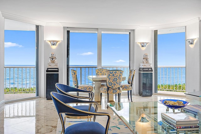 sunroom / solarium with a water view and a wealth of natural light