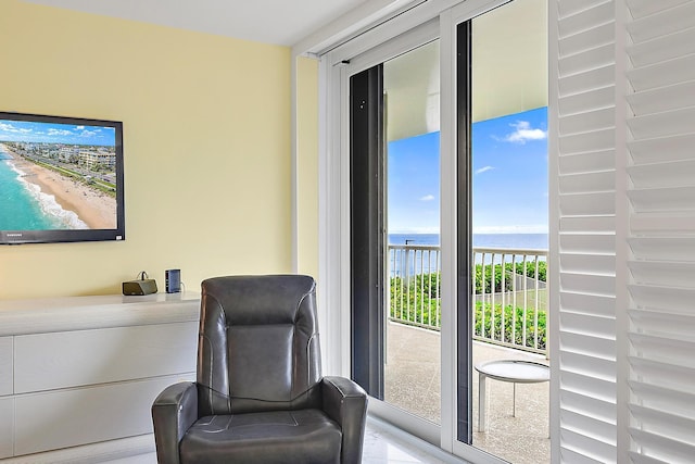 living area with a water view