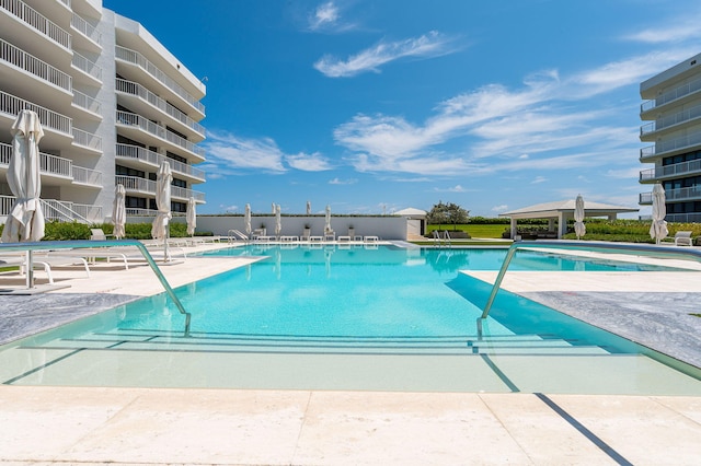 view of swimming pool featuring a patio