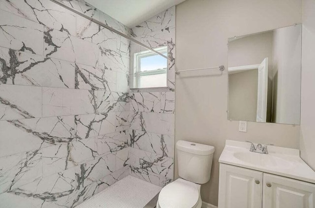 2511 W Abdella St, Tampa, FL 33607 - bathroom featuring toilet, vanity, and a tile shower