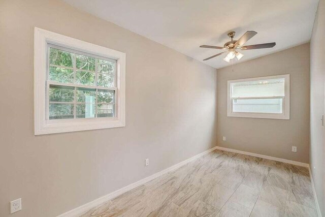 2511 W Abdella St, Tampa, FL 33607 - spare room featuring lofted ceiling and ceiling fan