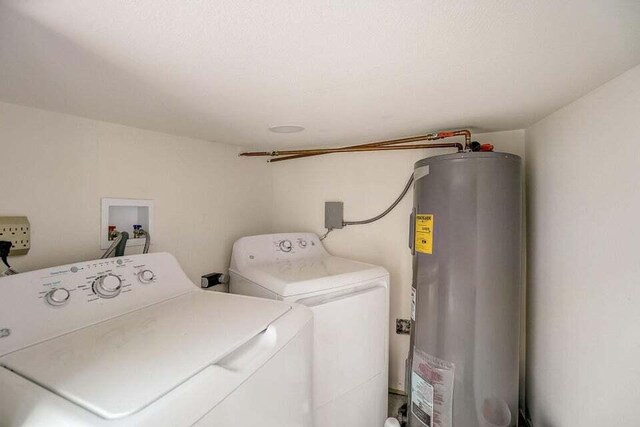 2511 W Abdella St, Tampa, FL 33607 - clothes washing area featuring washer and clothes dryer and gas water heater