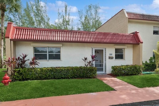 view of front of home with a front yard