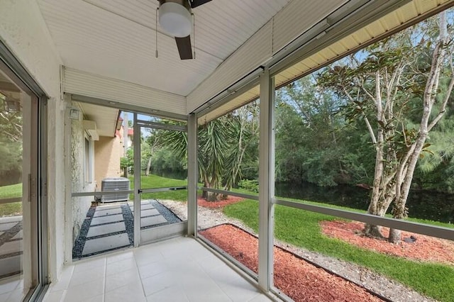 unfurnished sunroom featuring ceiling fan