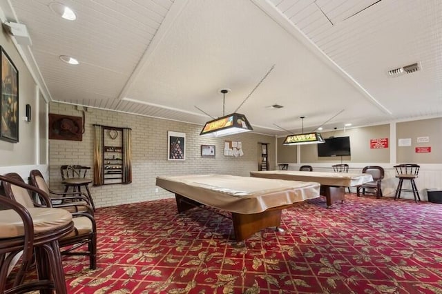 game room featuring brick wall and pool table