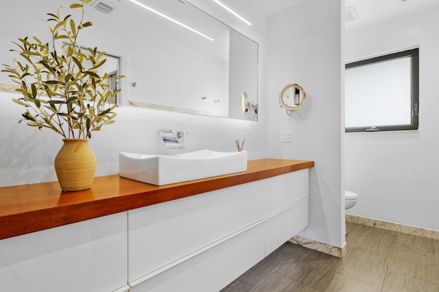 bathroom with vanity and toilet