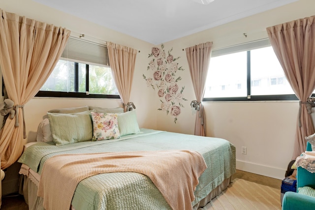 bedroom with hardwood / wood-style flooring