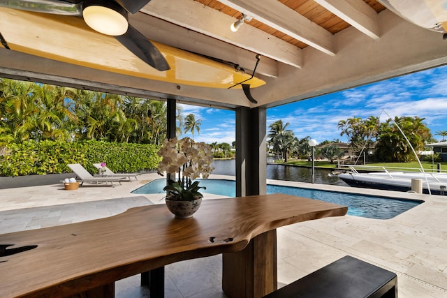 exterior space with a patio and a water view