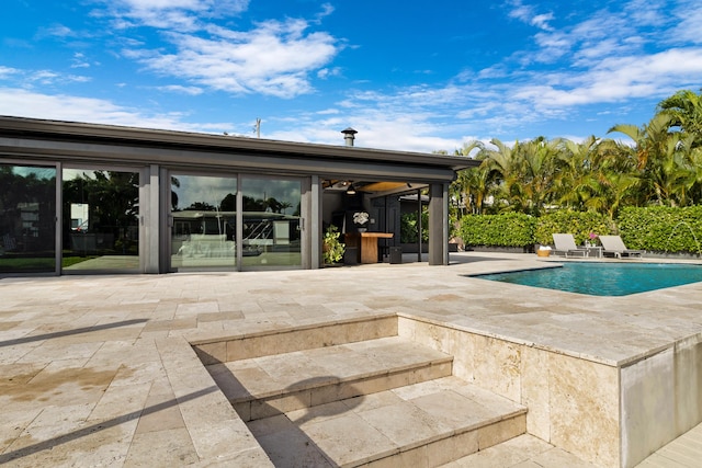 view of swimming pool with a patio area