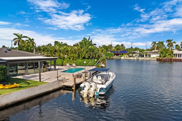 view of dock featuring a patio and a water view