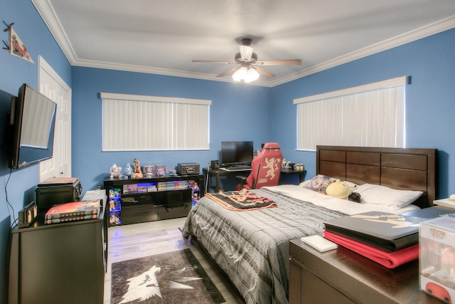 bedroom with a closet, crown molding, ceiling fan, and dark hardwood / wood-style flooring