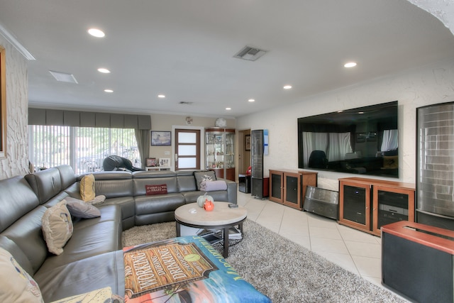 living room featuring ornamental molding and light tile patterned floors