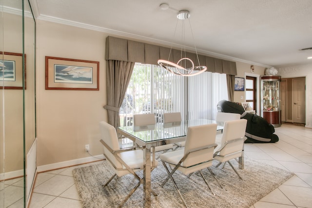 dining space with crown molding, a notable chandelier, and light tile patterned floors