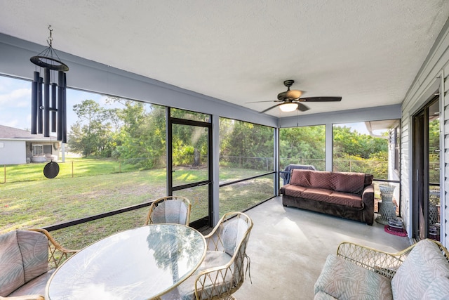 sunroom / solarium with ceiling fan and plenty of natural light