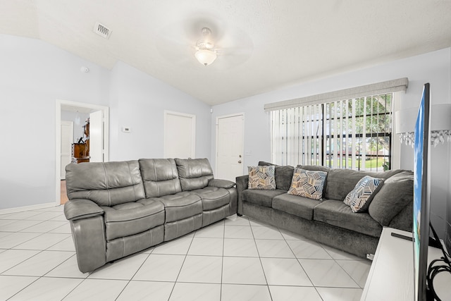 tiled living room featuring lofted ceiling, a textured ceiling, and ceiling fan