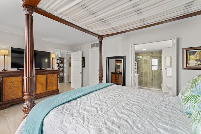 bedroom featuring light tile patterned floors, connected bathroom, decorative columns, and crown molding