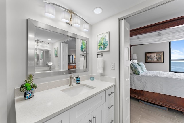 bathroom with tile patterned floors and vanity