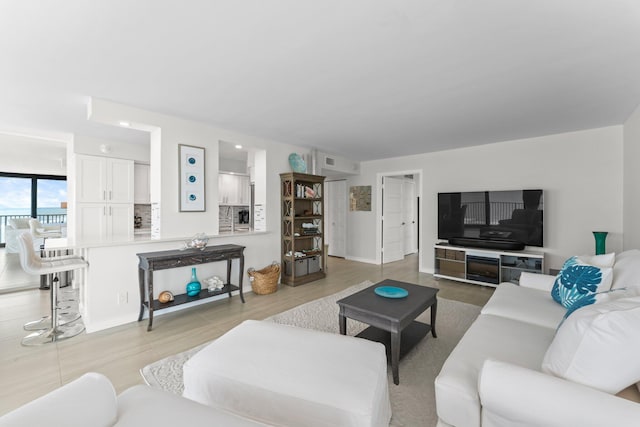 living room with light hardwood / wood-style floors