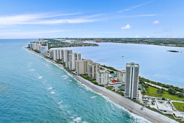 bird's eye view featuring a water view and a view of the beach