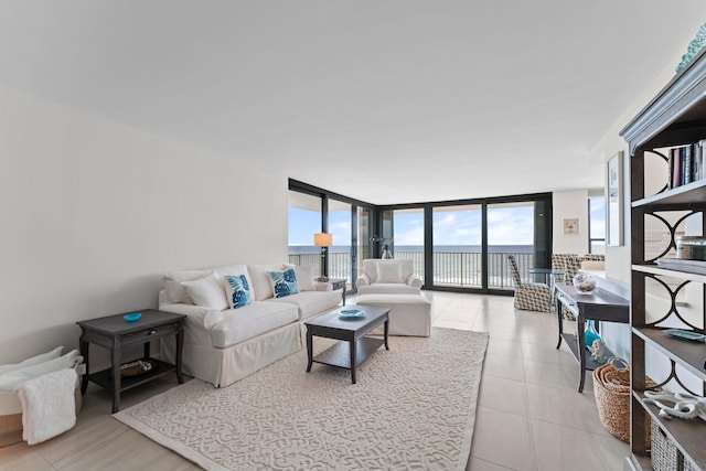 tiled living room featuring expansive windows