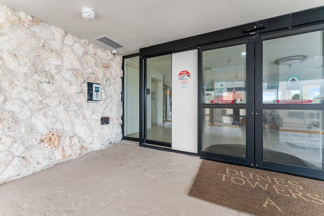 entrance to property featuring french doors