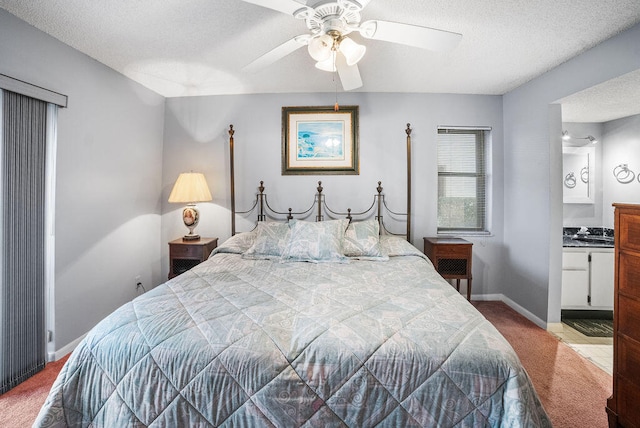 bedroom featuring ceiling fan, light colored carpet, and a textured ceiling