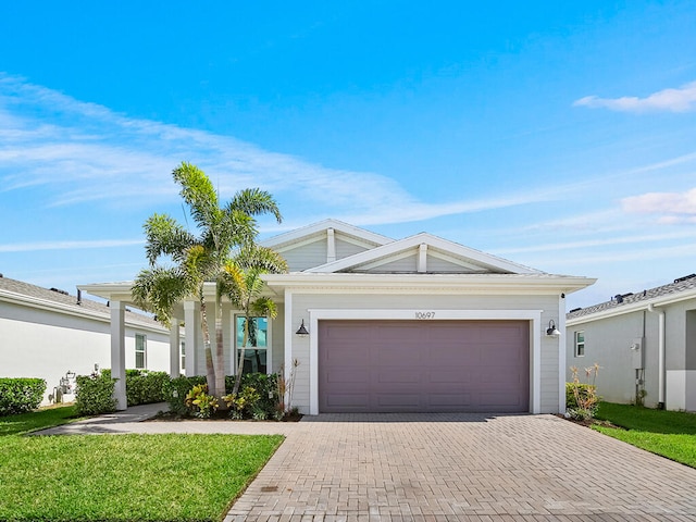 ranch-style house with a front lawn and a garage