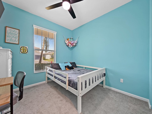 bedroom featuring light carpet and ceiling fan