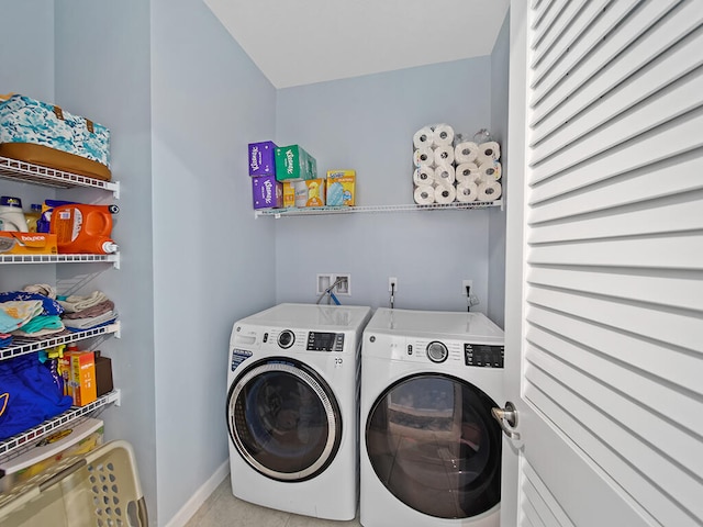 clothes washing area with washer and dryer