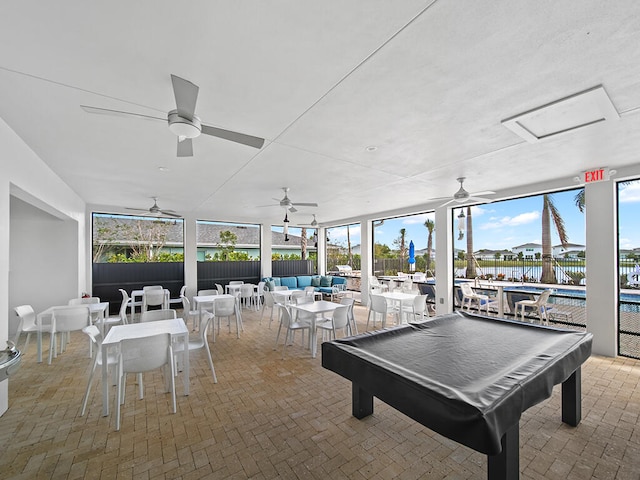 playroom with a water view and billiards