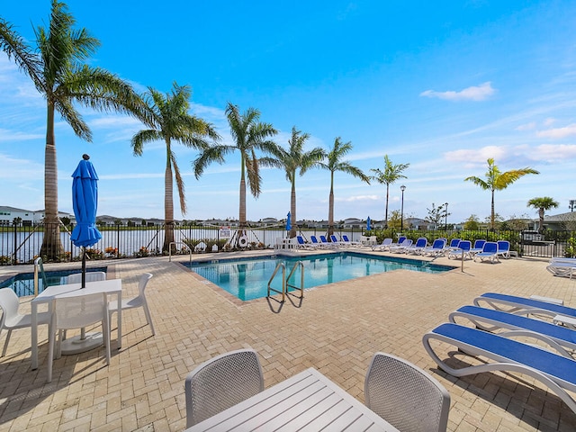 view of swimming pool with a patio