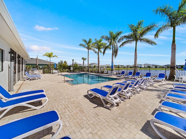 view of swimming pool with a patio