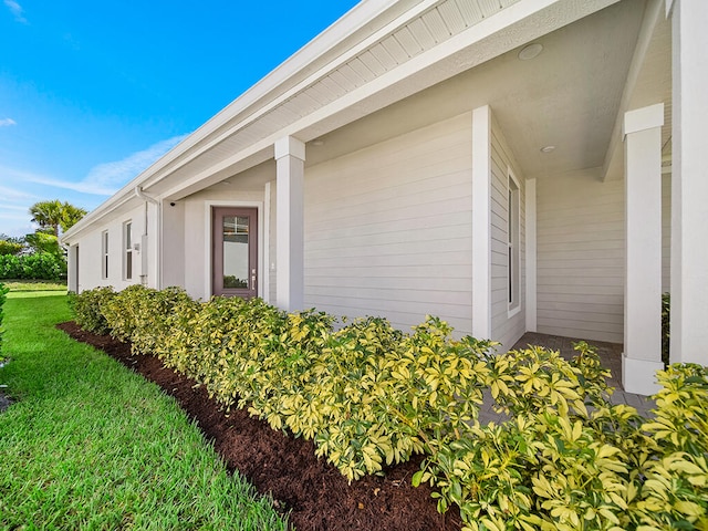 view of property exterior featuring a yard