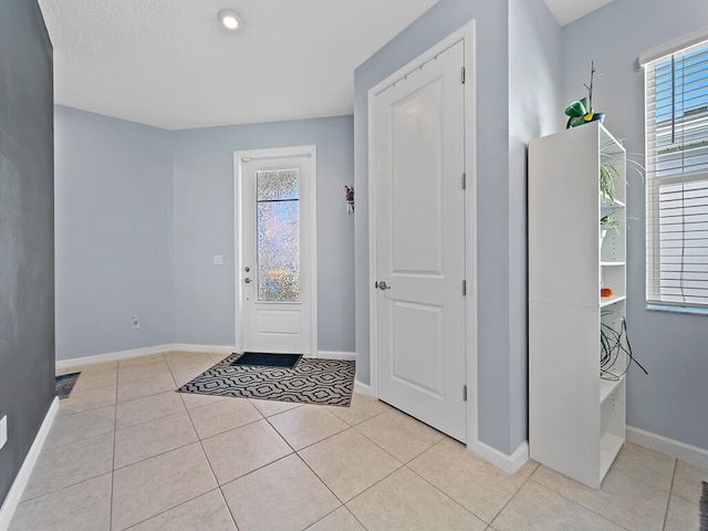 foyer with light tile patterned flooring