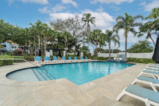 view of swimming pool with a patio