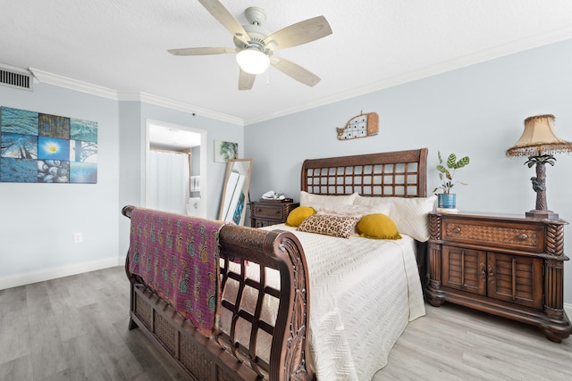 bedroom with ceiling fan, ornamental molding, and light hardwood / wood-style flooring