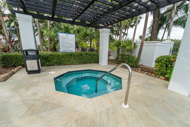 view of swimming pool featuring a community hot tub, a pergola, and a patio