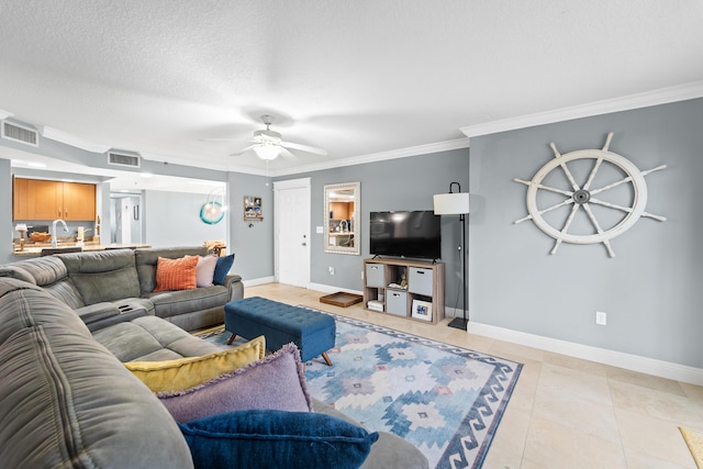 tiled living room featuring a textured ceiling, ceiling fan, and ornamental molding