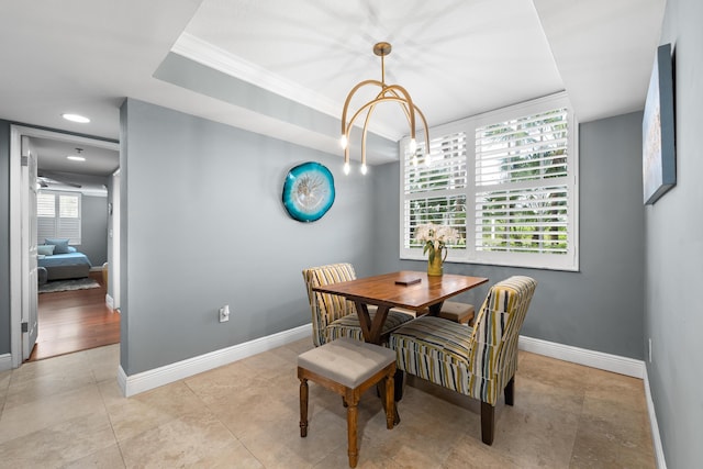 dining room with a healthy amount of sunlight and crown molding