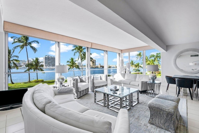 living room with plenty of natural light and a water view