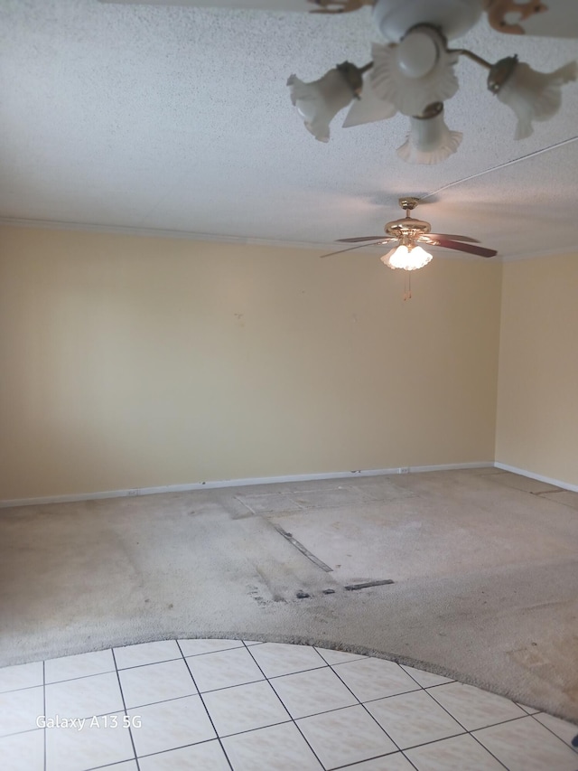 carpeted empty room with a textured ceiling and ceiling fan